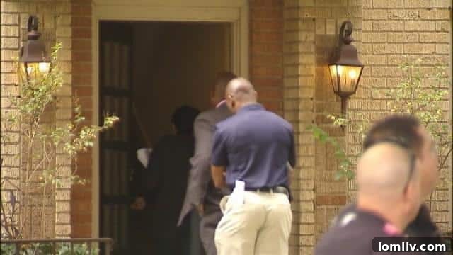 Dallas Nurse Becomes Nation's First Domestically Acquired Ebola Case, Second Overall 5 Healthcare workers in protective gear in Dallas
