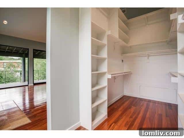 Spacious master closet with custom shelving and ample storage solutions