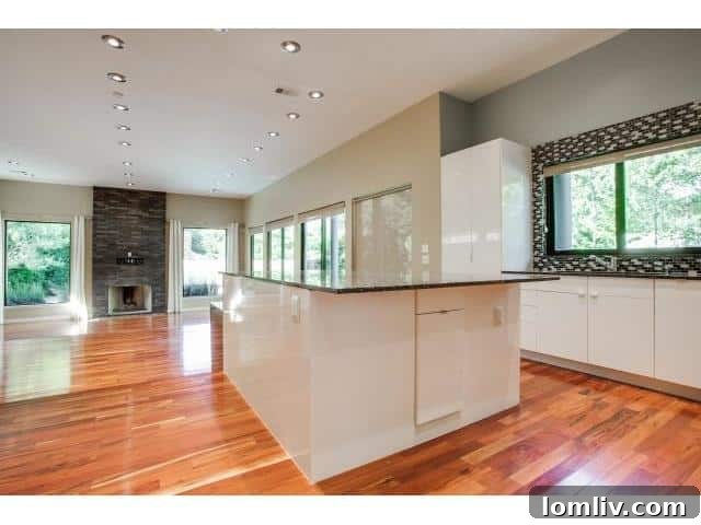 Modern kitchen with large island and sleek cabinetry at 2223 Kessler Woods Court