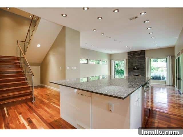 Contemporary kitchen view showing stainless steel appliances and ample counter space