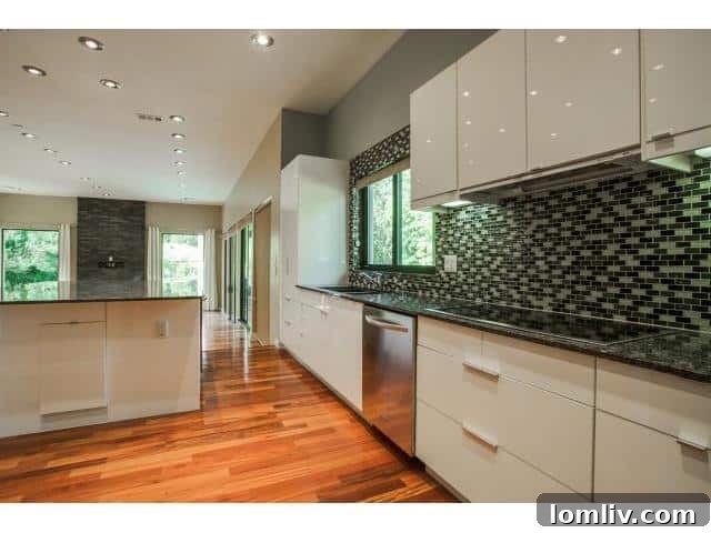 Kitchen island with bar seating and integrated sink in a luxury Dallas home