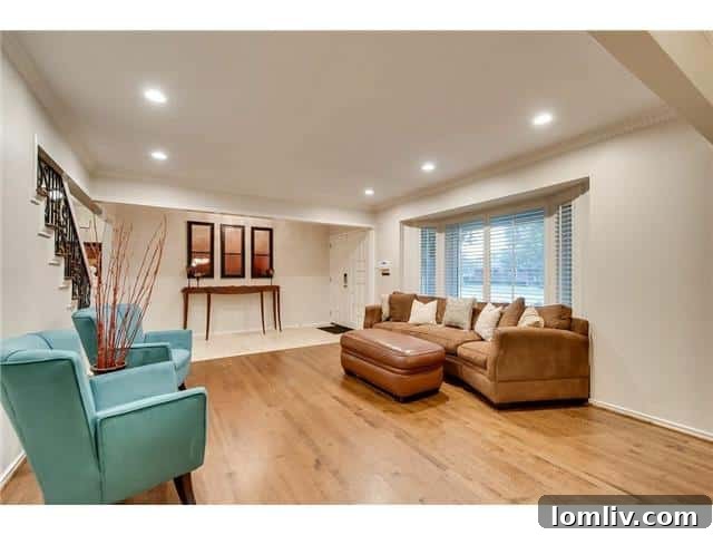 Sparkman Club: A Blend of Classic Elegance and Modern Luxury, Featuring a Magnificent Pool 3 The sophisticated formal living area at 3242 Princess Lane, offering an inviting entry into this elegant Sparkman Club Estates home.