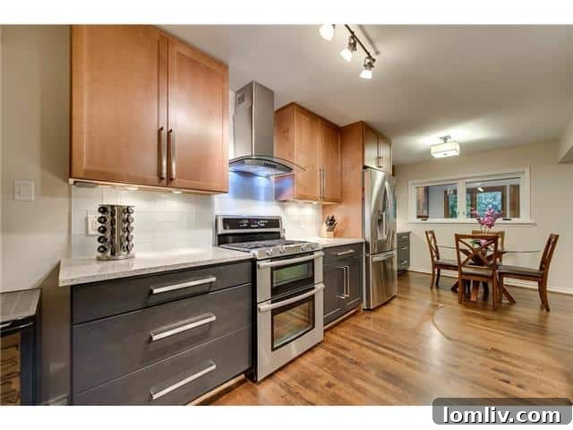 State-of-the-art kitchen at 3242 Princess Lane, featuring custom cabinetry, granite counters, and stainless steel appliances.