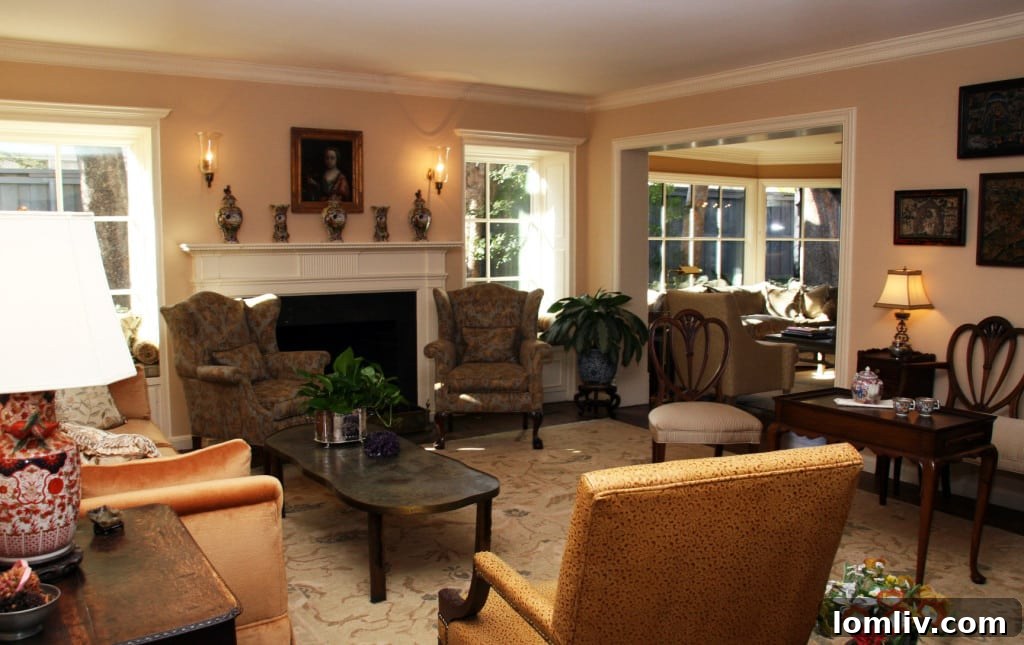 Expansive and elegantly furnished living room or common area with large windows, showcasing the transformed interior.