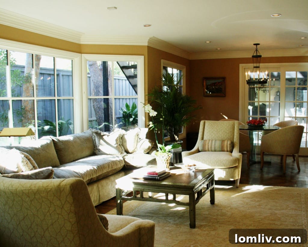 Bright and airy sunroom with multiple windows, providing ample natural light and a view of the outdoors, furnished for relaxation.
