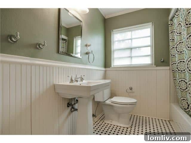 Charming hall bathroom with beadboard and subway tile at 1108 Valencia