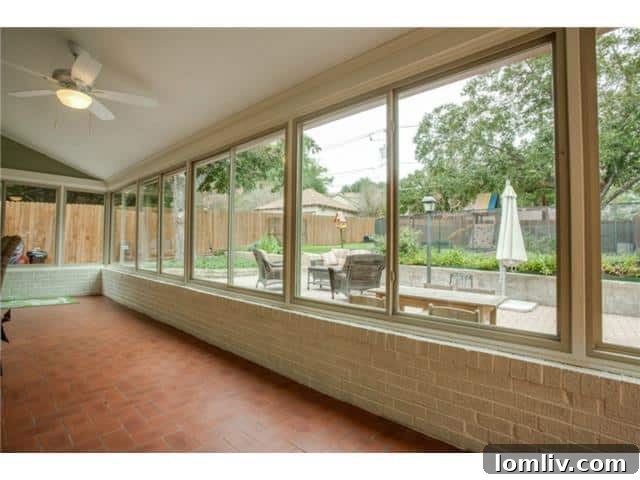 Bright sunroom at 1108 Valencia overlooking the backyard, ideal for relaxing or dining