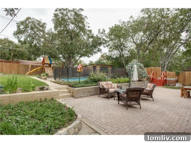 Expansive brick patio and pool in the backyard of 1108 Valencia, perfect for entertaining