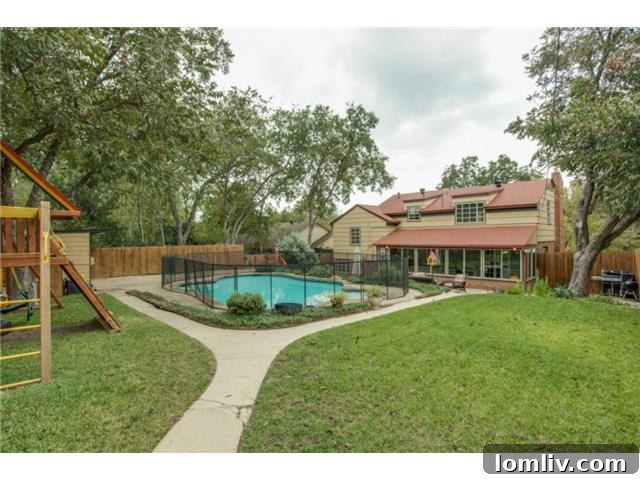 Aerial view of the backyard patio and pool at 1108 Valencia, showcasing the large lot