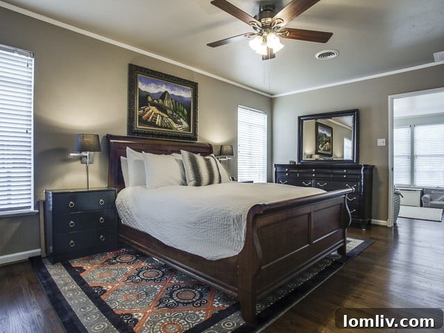 Another perspective of the master bedroom, showcasing its comfortable and inviting ambiance.