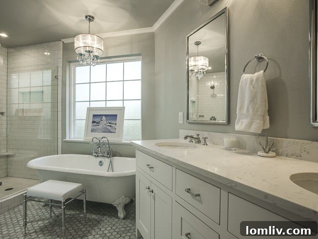 Luxurious master bathroom with modern fixtures, elegant tiling, and a spacious vanity.