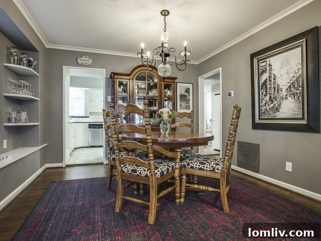 Elegant dining room with ample space for entertaining, reflecting the home's traditional aesthetic.