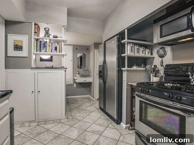 Updated kitchen with modern appliances and a breakfast bar, blending functionality with style.