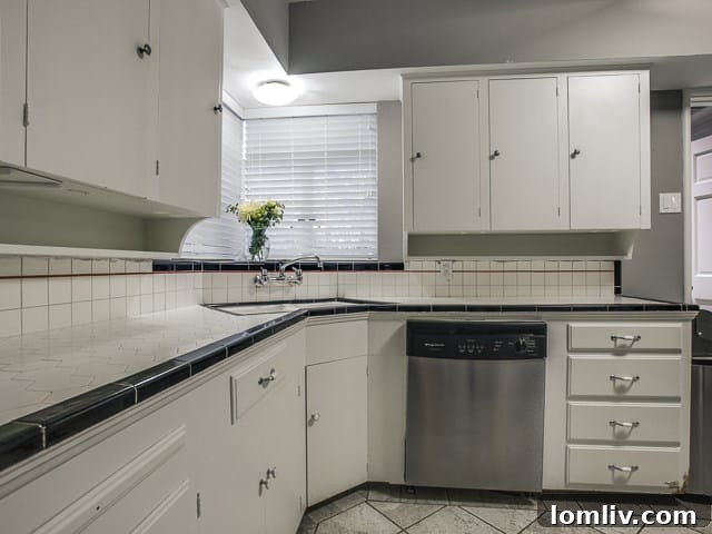 View of the kitchen showing ample counter space and cabinet storage.