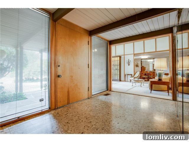 Elegant Foyer with Terrazzo Floors and Architectural Features