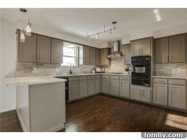 Close-up of Santa Cecilia white granite countertops and marble tile backsplash in the kitchen