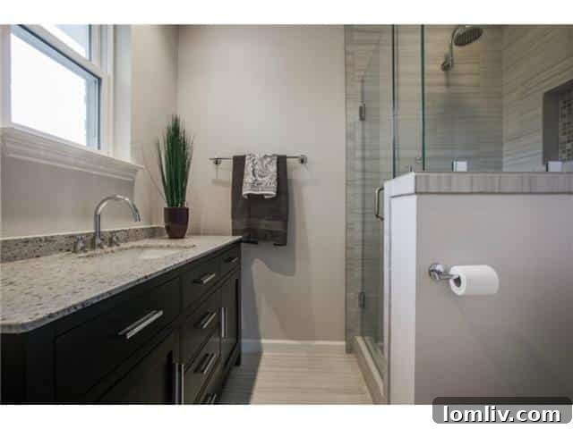 Luxurious master bathroom with frameless glass shower and elegant porcelain tiles