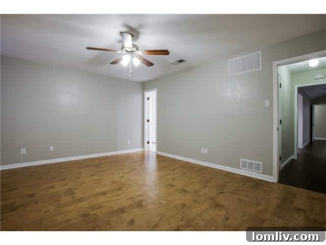 Comfortable bedroom with hardwood floors in the updated Richardson contemporary house