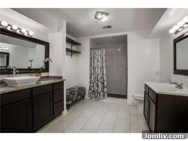 Master bathroom with updated fixtures and unique vanity tops at 13016 Fall Manor