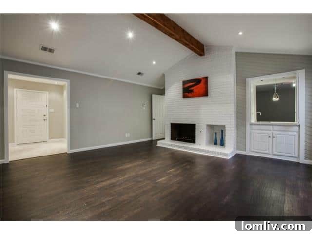 Spacious living room with hardwood floors and natural light at 13016 Fall Manor