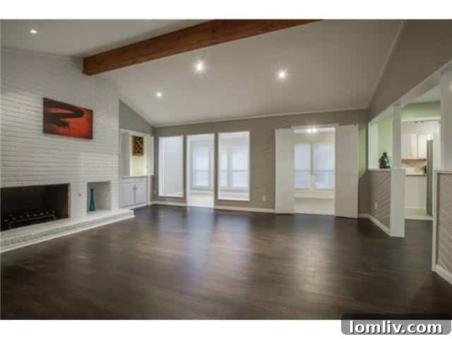 Cozy living room with fireplace, perfect for gatherings in this Richardson home