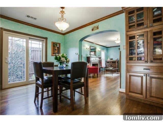 Elegant formal dining room with ample natural light, perfect for entertaining guests