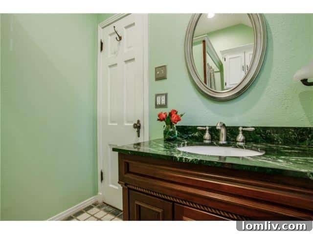 Modern and renovated en-suite master bathroom featuring stylish fixtures and finishes
