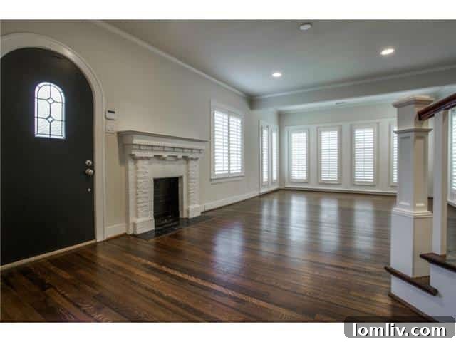 Grand entry foyer with polished dark hardwood floors and exquisite detailing at 5234 Monticello Avenue