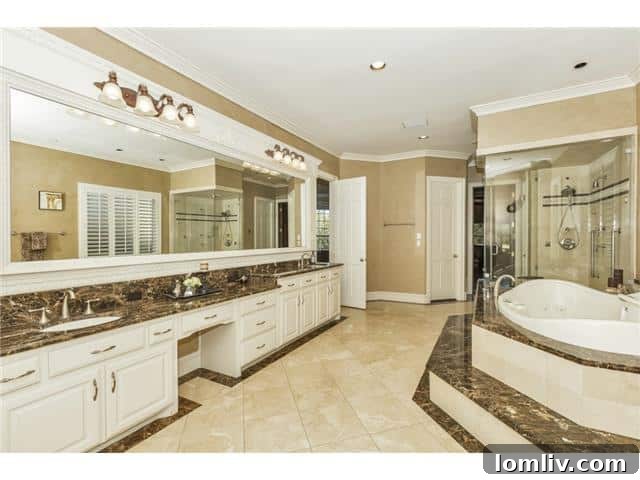 Opulent master bathroom with a large tub and high-end finishes.