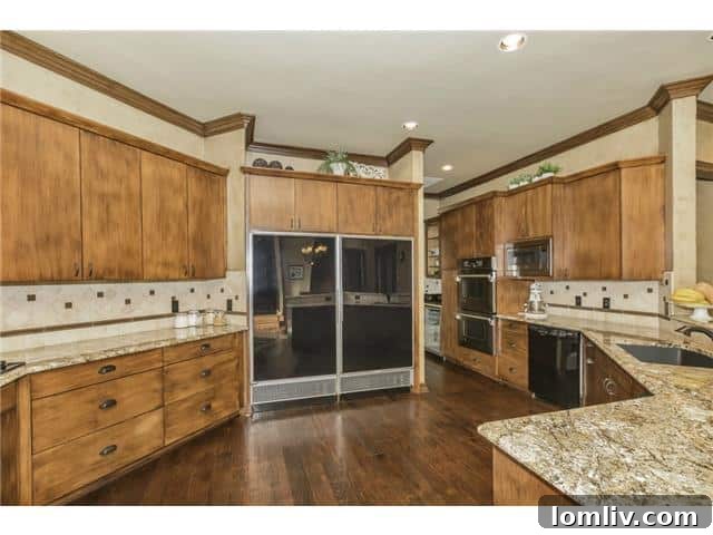 Gourmet kitchen with island and high-end appliances at 50 Picadilly Park.