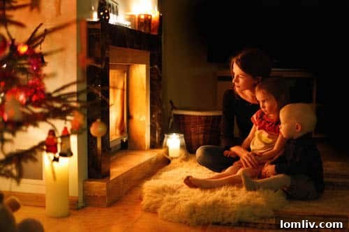 Family gathered by a cozy Christmas hearth, embracing the festive atmosphere and warmth of the holiday season