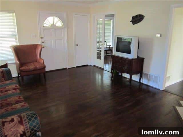 Seeking East Dallas Midcentury Original Hardwoods This Christmas 8 Interior room showcasing original hardwood floors at 9835 County Cork Dr, offering immense renovation potential