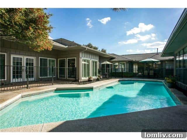 Stunning backyard with a beautiful swimming pool, perfect for relaxation and entertaining
