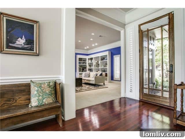 Welcoming entry hall of 16311 Dalmalley Lane with warm decor
