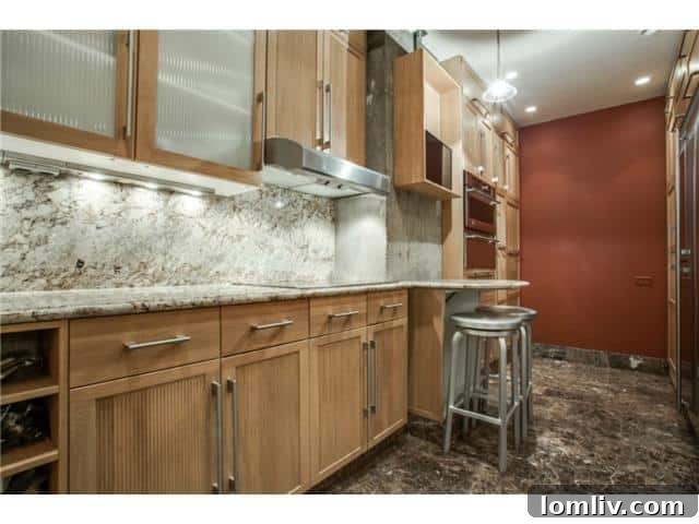 Stunning Views, Incredible Value 7 Athena-unit-1416-Kitchen-2: Kitchen island with elegant veined granite surface.