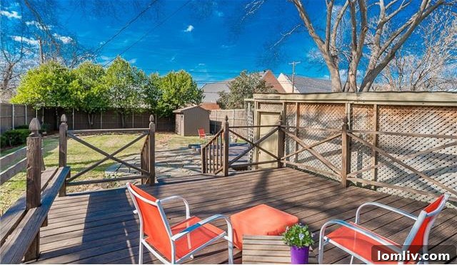 Historic North Oak Cliff Tudor: Stained Glass and Chambers Stove Legacy 18 Expansive and beautifully landscaped backyard of 1325 Hollywood Ave, featuring a wood and stone deck for outdoor living