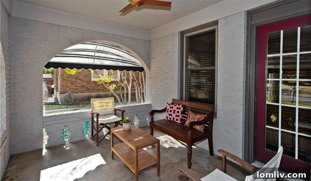 Historic North Oak Cliff Tudor: Stained Glass and Chambers Stove Legacy 4 Welcoming covered front porch of 1325 Hollywood Ave, featuring arched openings and ample space