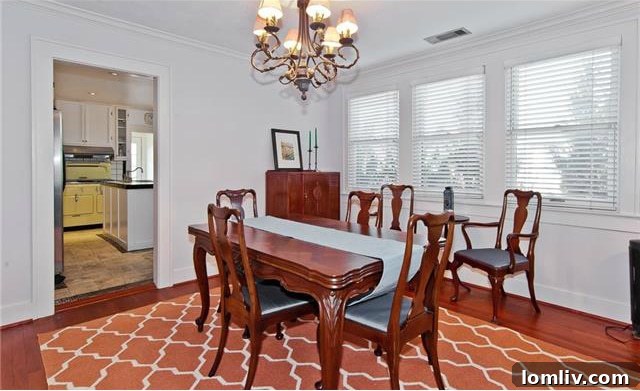 Historic North Oak Cliff Tudor: Stained Glass and Chambers Stove Legacy 7 Spacious dining room in 1325 Hollywood Ave with large, energy-efficient windows and continuous hardwood flooring