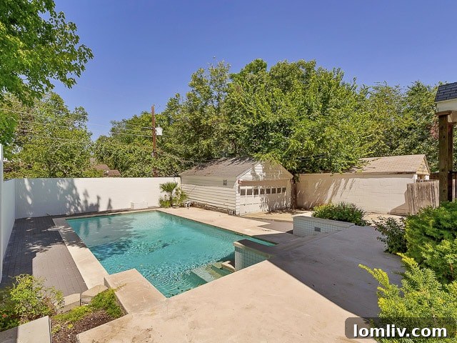 Inviting backyard with a sparkling saltwater pool, perfect for summer relaxation and entertaining