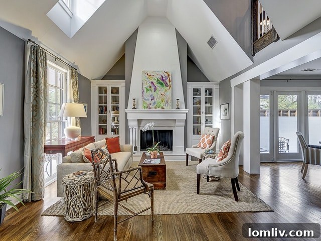Spacious and bright living room with large windows and elegant decor