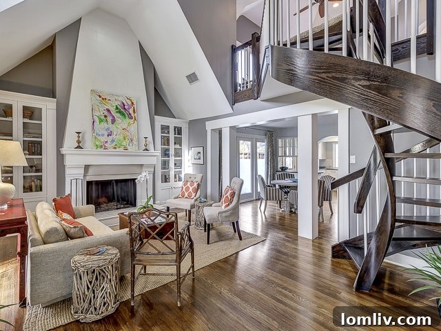 Elegant wooden spiral staircase, a focal point of the living space, leading to upper floors