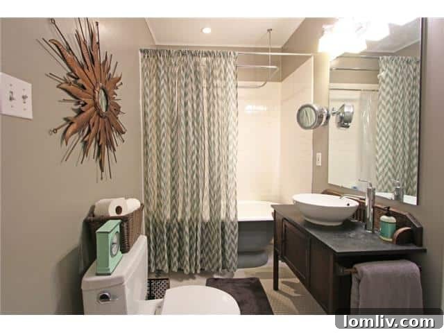 Updated Master Bathroom with Modern Fixtures and Elegant Tiling