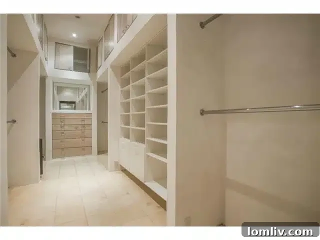 Bluffview's Hidden Lakemont Castle: A Limestone Ode to Santa Barbara 14 8626 Lakemont Walk-in Closet - Spacious Storage