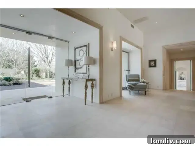 Bluffview's Hidden Lakemont Castle: A Limestone Ode to Santa Barbara 3 8626 Lakemont Foyer - Luxury Dallas Entryway