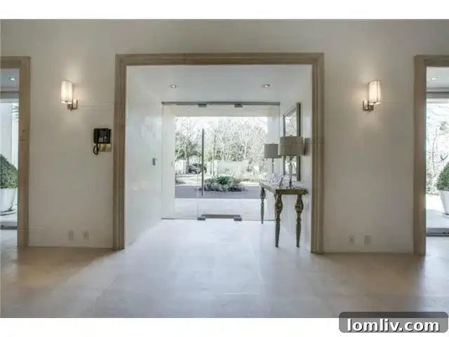 Bluffview's Hidden Lakemont Castle: A Limestone Ode to Santa Barbara 4 8626 Lakemont Foyer - Interior Design Details