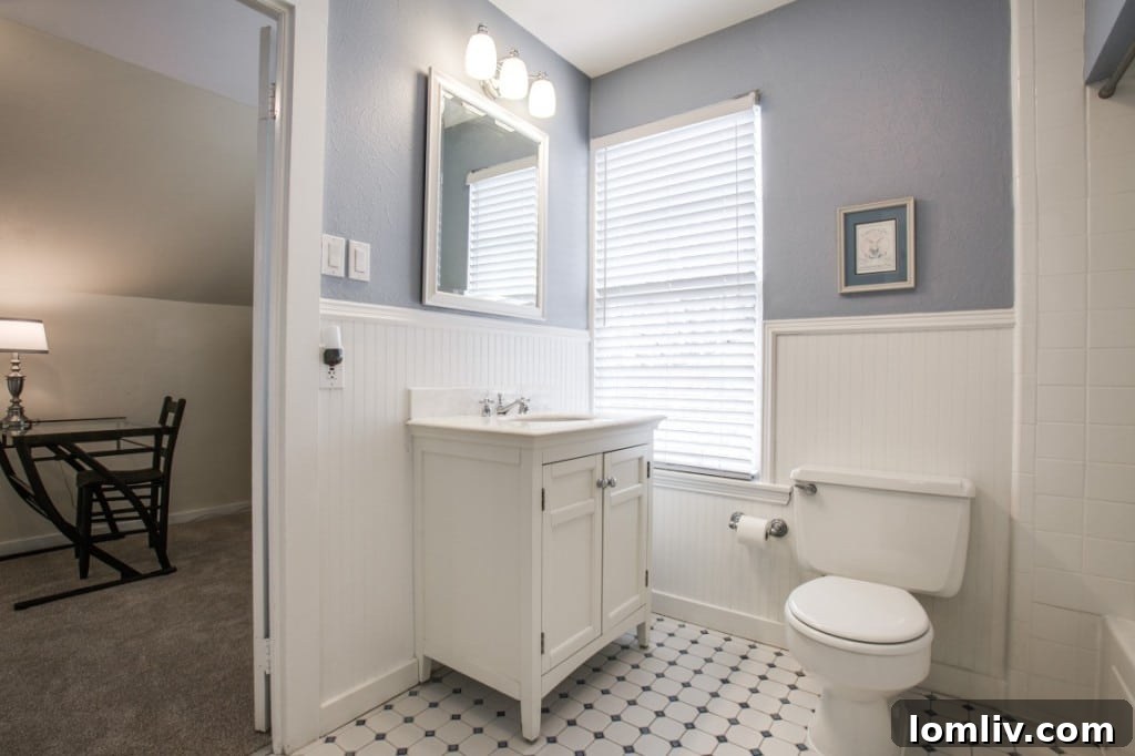 The updated kitchen features modern appliances and finishes
