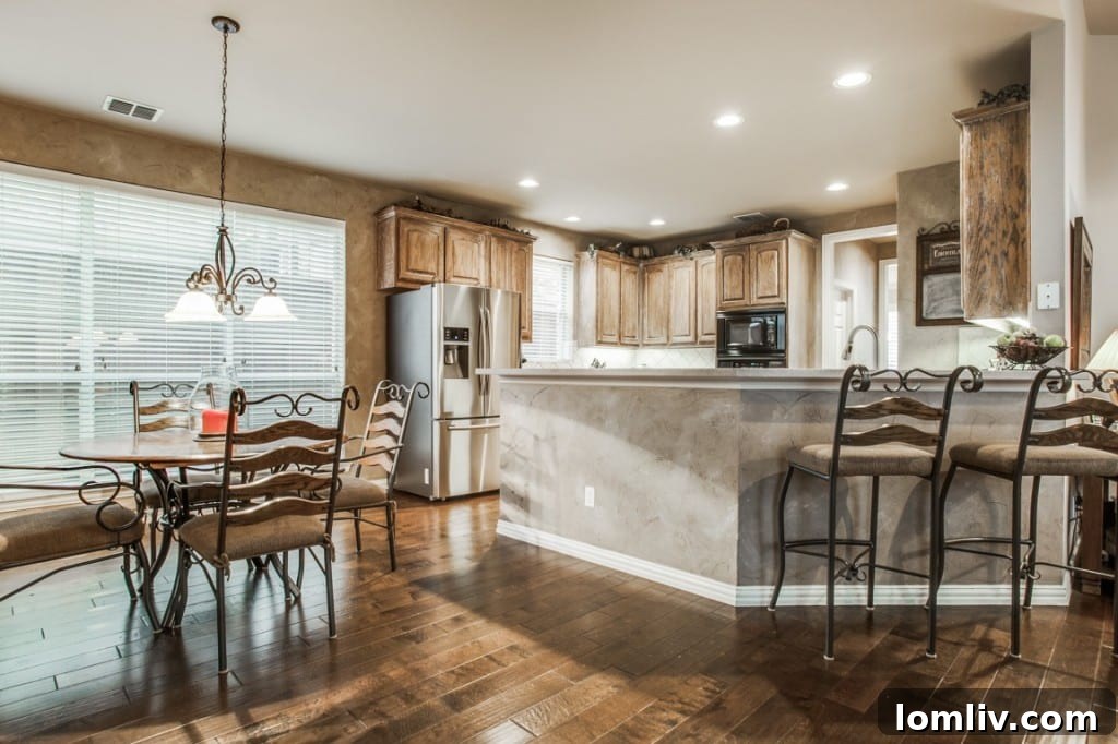 An inviting secondary bedroom, well-lit and comfortably appointed, perfect for family or guests.