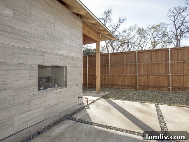 The Remodeled Ranch Driving Midway Hollow's Boom 16 Outdoor Fireplace and Pergola Feature