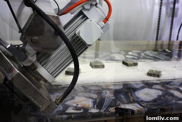 Rock Solid Insights From Allied Stone 9 Computer-operated machine precisely cutting an agate slab for custom stone projects