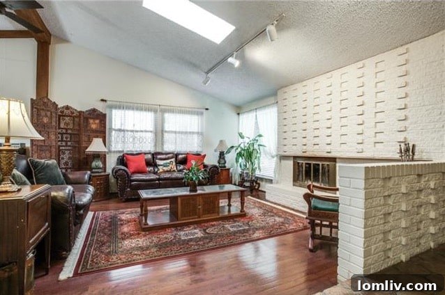 Spacious Living Area with Hardwood Floors and Wood Beams at 3714 Crown Shore Dr